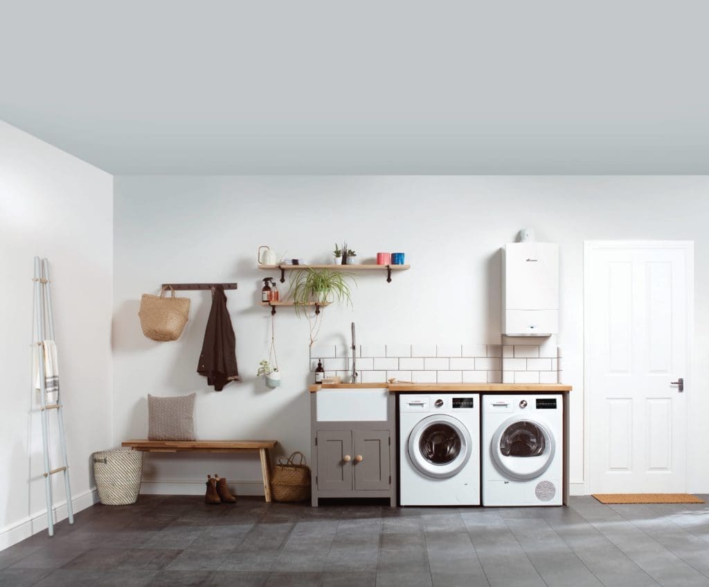 A laundry room with a washing machine and dryer offering 0% Interest Free Credit.